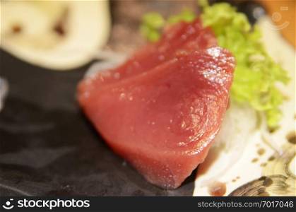 Tuna sashimi cutting raw blue fin tuna and serve in Japanese style foo