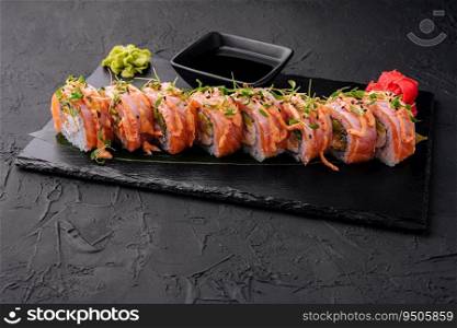 tuna sushi roll on black board