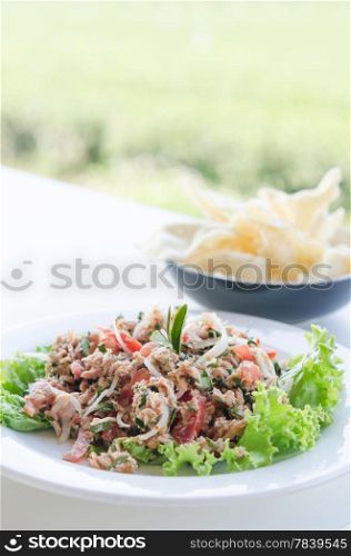 Tuna with tea leaves and mix vegetables , spicy salad