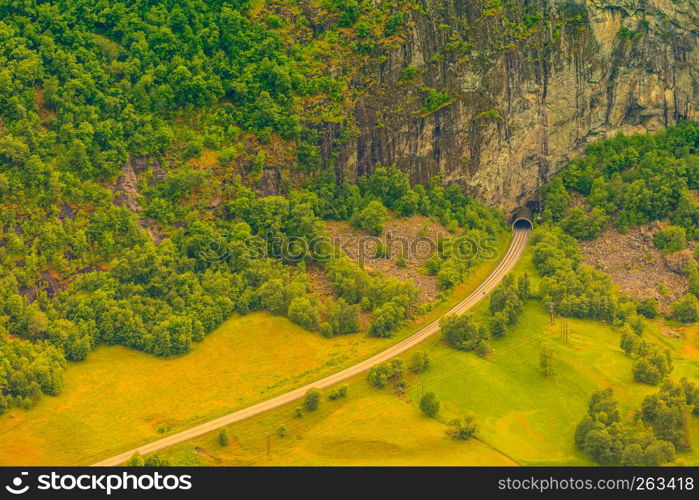 Tunnel entrance at the norwegian green summer mountains, Norway Scandinavia. tunnel on the norwegian mountain road