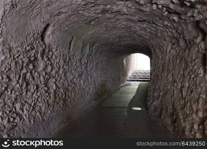 tunnel with walls made of stone