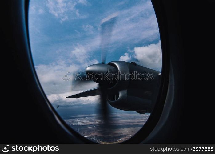 Turboprop engine view from illuminator with aerial bright background