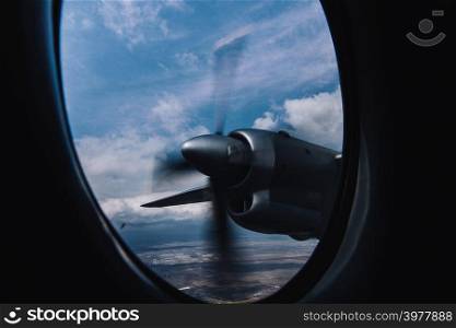 Turboprop engine view from illuminator with aerial bright background