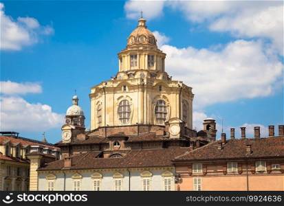 TURIN, ITALY - CIRCA AUGUST 2020  perspective on the elegant and Baroque Saint Lawrence church in Turin. Amazing natural light with a blue sky.