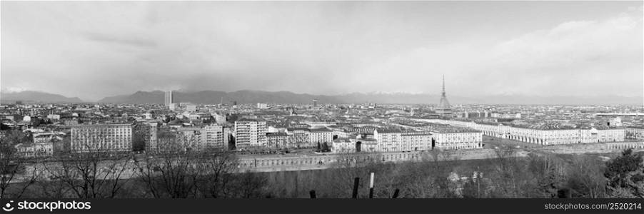 TURIN, ITALY - CIRCA FEBRUARY 2020: Wide panoramic aerial view of the city of Turin seen from the hill in black and white. Wide panoramic aerial view of Turin in black and white