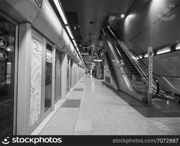 TURIN, ITALY - CIRCA NOVEMBER 2018: Lingotto underground station in black and white. Lingotto subway station in Turin in black and white