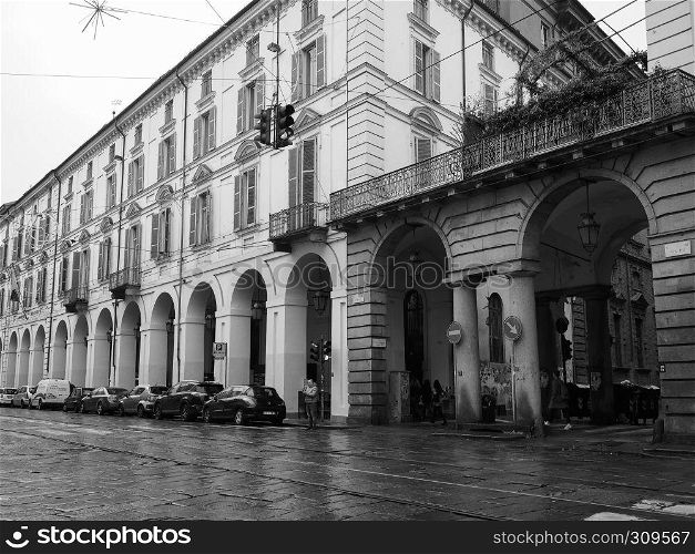 TURIN, ITALY - CIRCA NOVEMBER 2018: Rainy day in Via Po in black and white. Via Po in Turin in black and white