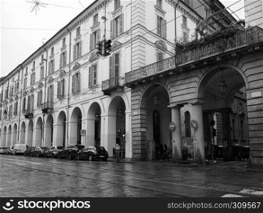 TURIN, ITALY - CIRCA NOVEMBER 2018: Rainy day in Via Po in black and white. Via Po in Turin in black and white