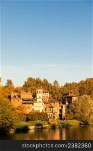 Turin, Italy - Circa November 2021: outdoors panorama with scenic Turin Valentino castle at sunrise in autumn
