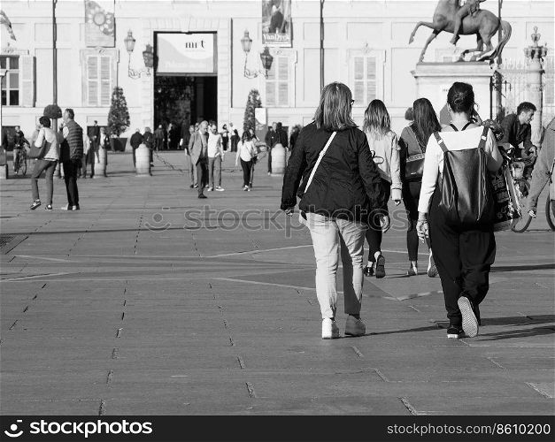 TURIN, ITALY - CIRCA OCTOBER 2018: People in Piazza Castello square in black and white. Piazza Castello square in Turin in black and white