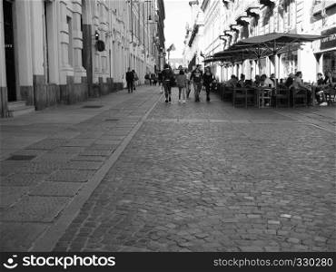 TURIN, ITALY - CIRCA OCTOBER 2018: People in Via Lagrange the city centre in black and white. People in city centre in Turin in black and white