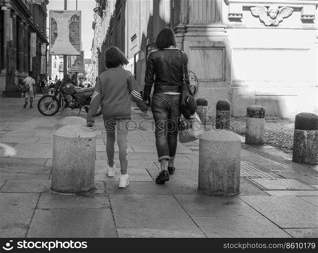 TURIN, ITALY - CIRCA OCTOBER 2018: People in Via Lagrange the city centre in black and white. People in city centre in Turin in black and white