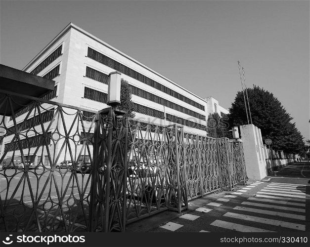 TURIN, ITALY - CIRCA SEPTEMBER 2018: Fiat Chrysler Automobiles (FCA) Mirafiori car factory for Fiat, Lancia, Alfa Romeo, Jeep and Abarth brands in black and white. Fiat Mirafiori Chrysler Automobiles (FCA) car factory in Turin in black and white
