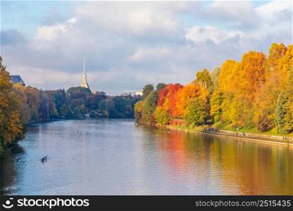 Turin, Piedmont Region, Italy - Circa November 2021: landscape in autumn with Po&rsquo; river and blue sky.