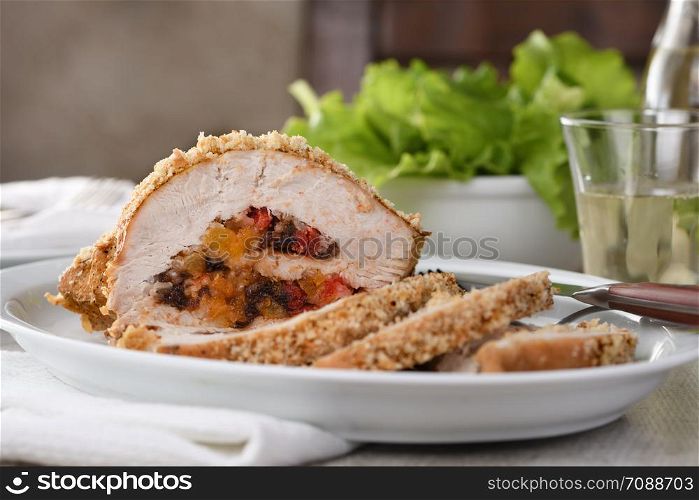 turkey breast stuffed with dried prunes, dried apricots and cherries in breadcrumbs and parmesan breading