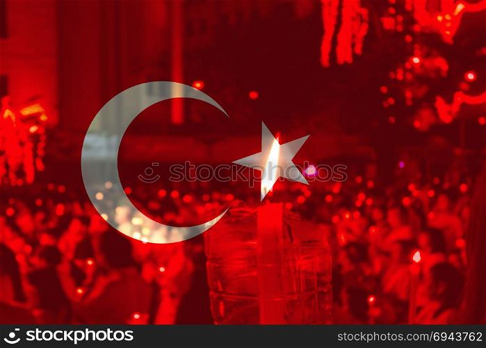 Turkey flag with people praying.. Turkey flag with people praying in background.