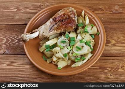 Turkey leg with baked potatoes .country cuisine