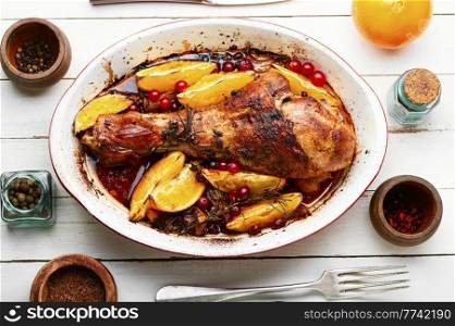 Turkey meat baked in oranges. Delicious roasted turkey leg. Baked turkey meat with citrus fruit