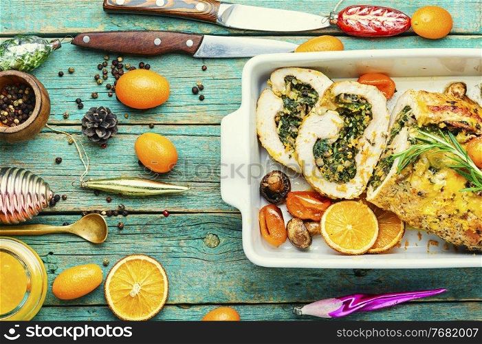 Turkey meatloaf with spinach and mushrooms. Meat roll with kumquat and orange sauce.. Turkey meatloaf stuffed with herbs,top view
