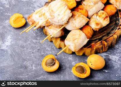 Turkey shish kebab on skewers with apricots.. Tasty grilled turkey