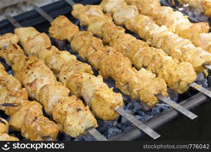 Turkey skewers marinated with spices on the grill. Fresh tasty grilled meat. Turkey skewers marinated with spices on the grill