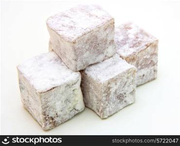 Turkish delight (lokum) confection on a white background