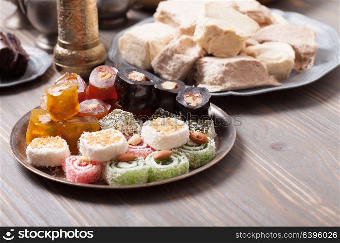 Turkish delight lokum with nuts on metal plate. Turkish delight rahat lokum