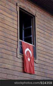 Turkish flag hanging on window