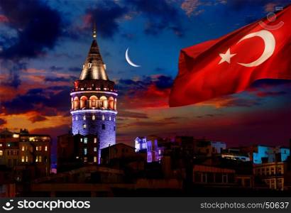 Turkish flag illuminated Galata Tower in Istanbul at night, Turkey