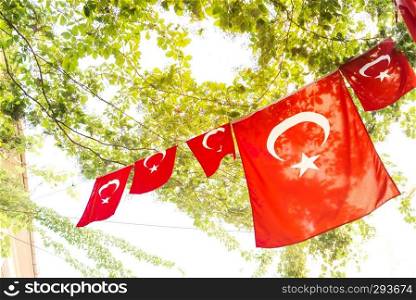 Turkish flags and View of Kadikoy Popular streets where People love walking and visiting.Kadikoy is one of  largest popular and cosmopolitan districts of Istanbul.