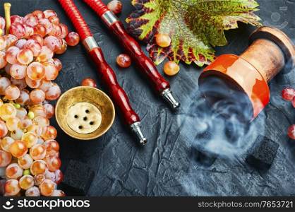 Turkish hookah with hookah tobacco with grape flavor. Oriental smoking hookah