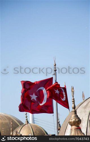 Turkish national flag and domes in open air