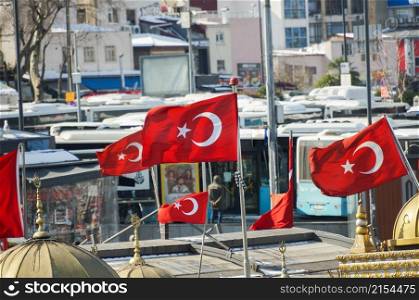 Turkish national flag hang on a pole in open air waving against sky