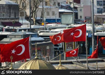 Turkish national flag hang on a pole in open air waving against sky