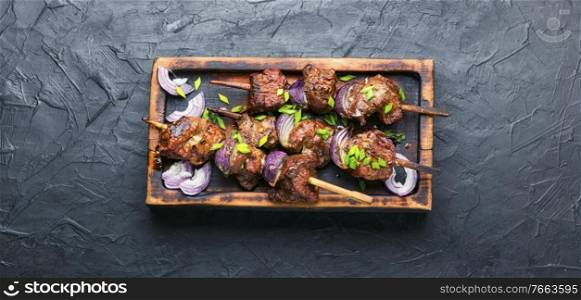 Turkish or arabic tradition liver kebab on skewers. Grilled beef liver kebabs