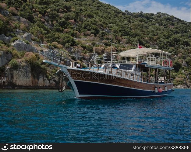 Turkish pleasure boat cruising near Kalekoy, Southern Turkey.