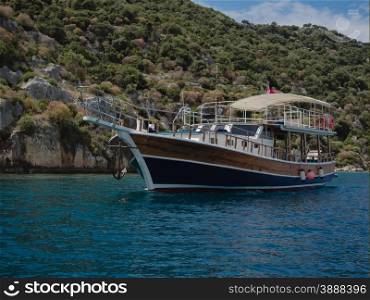 Turkish pleasure boat cruising near Kalekoy, Southern Turkey.