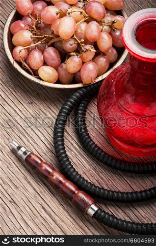 Turkish shisha hookah with aroma grapes for relax.Grapes shisha.Hookah concept. Hookah with autumn grapes