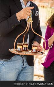 Turkish tea is served in traditional glass