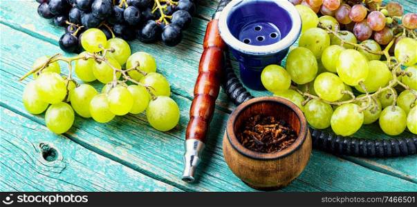 Turkish tobacco hookah with grapes aroma.Kalian with berry. Shisha with grapes flavor