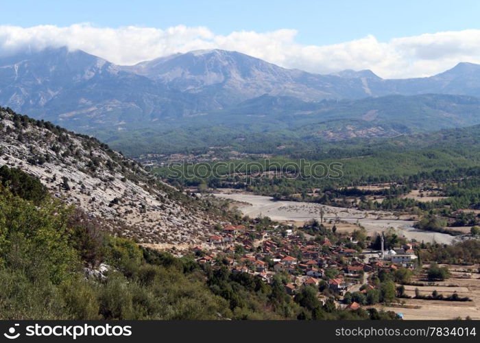 Turkish village in valley near mount in Turkey