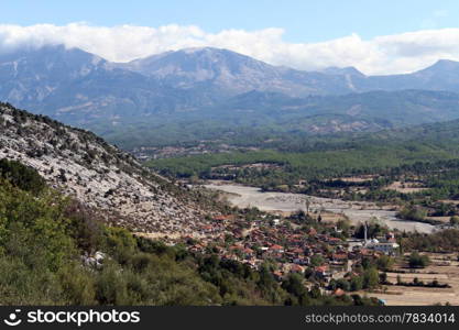 Turkish village in valley near mount in Turkey