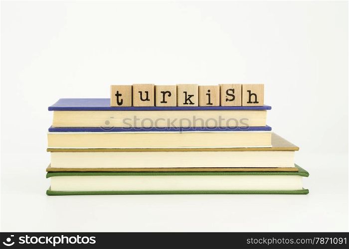 turkish word on wood stamps stack on books, language and academic concept