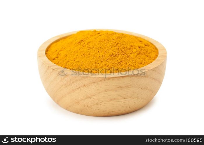 turmaric powder in wooden bowl isolated on white background with clipping path