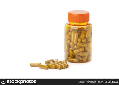 turmeric or longa capsule in bottle isolated on white background with clipping path