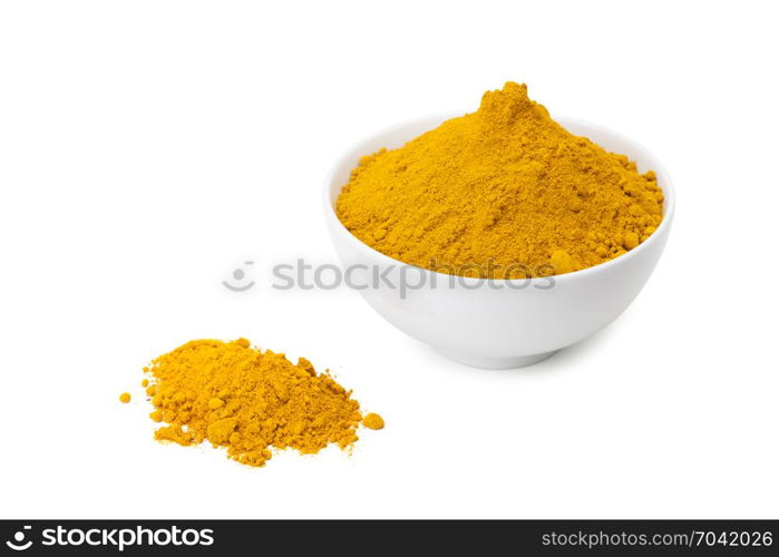 turmeric powder in white ceramic bowl isolated on white background