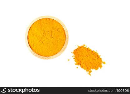 turmeric powder in wooden bowl isolated on white background