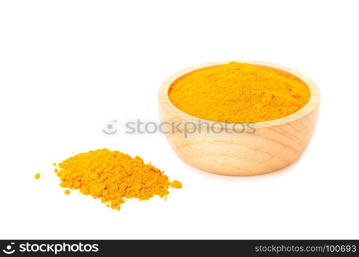 turmeric powder in wooden bowl isolated on white background
