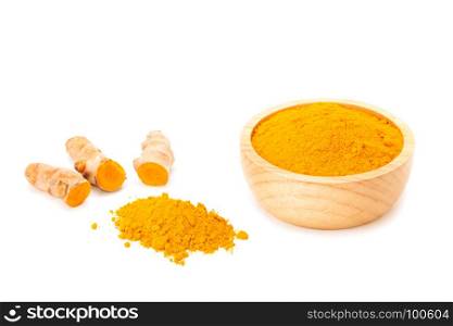 Turmeric rhizome and turmeric powder in wooden bowl isolated on white background