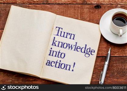Turn knowledge into action! Motivational words in an old notebook with a cup of coffee